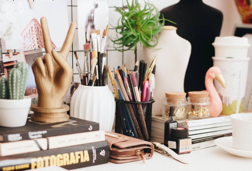 office desk with pencils and books